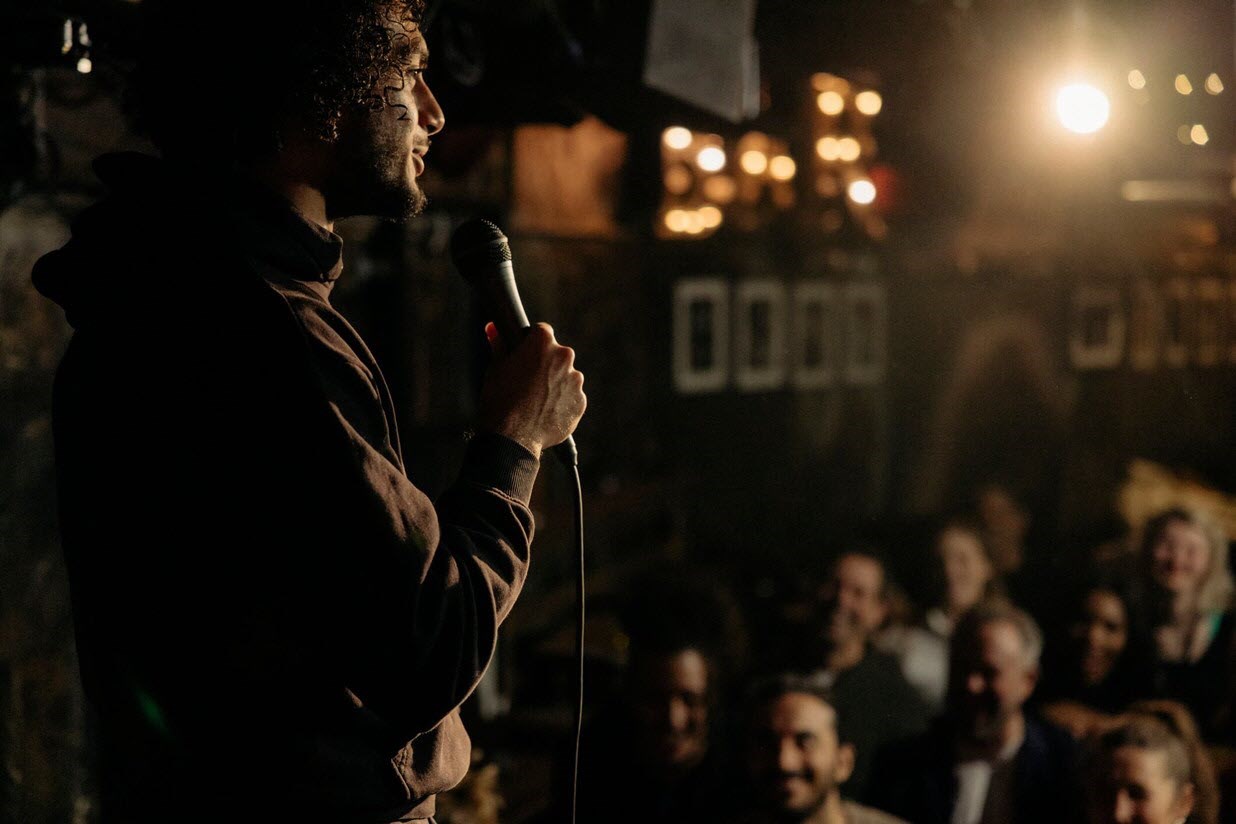 Young caregiver performing stand-up comedy as his new passion 