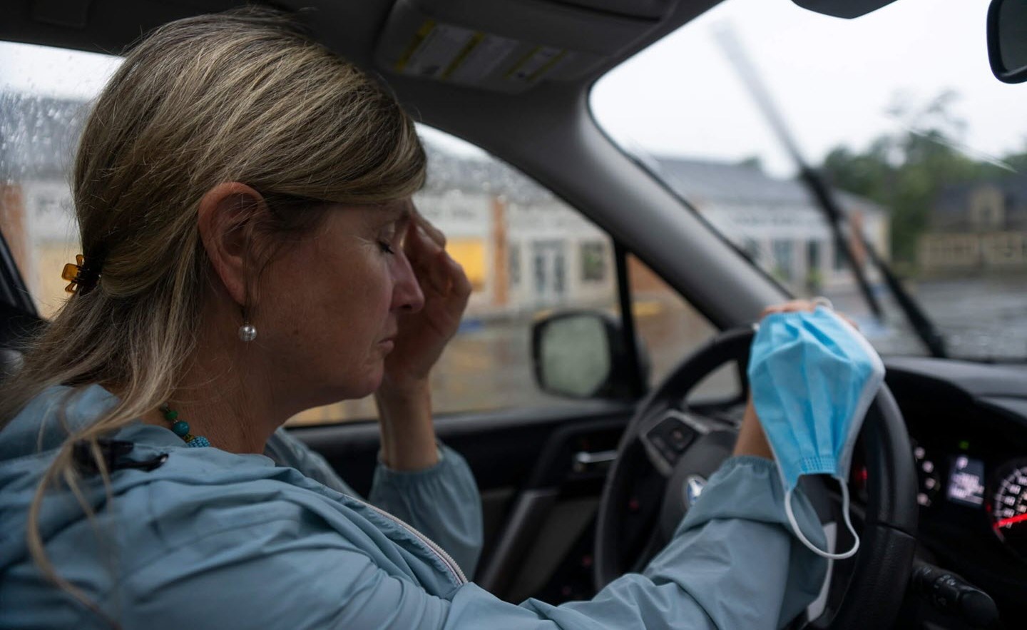 Nurse suffering from migraine symptoms as she prepares to drive home from work