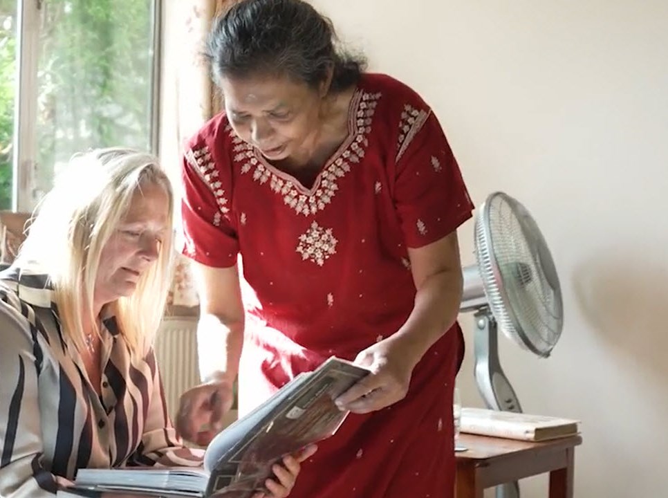 Women looking at album