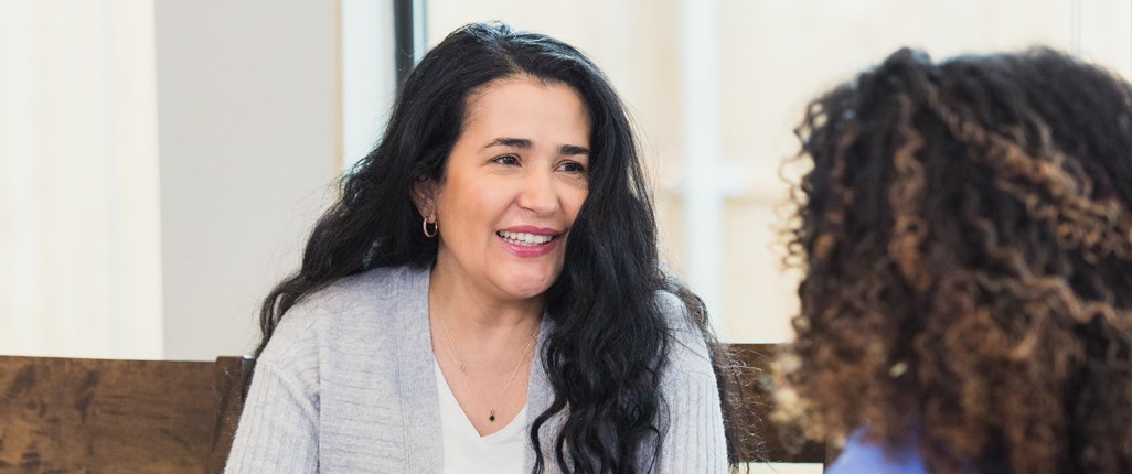 A patient at a mental health clinic talks to mental health care worker