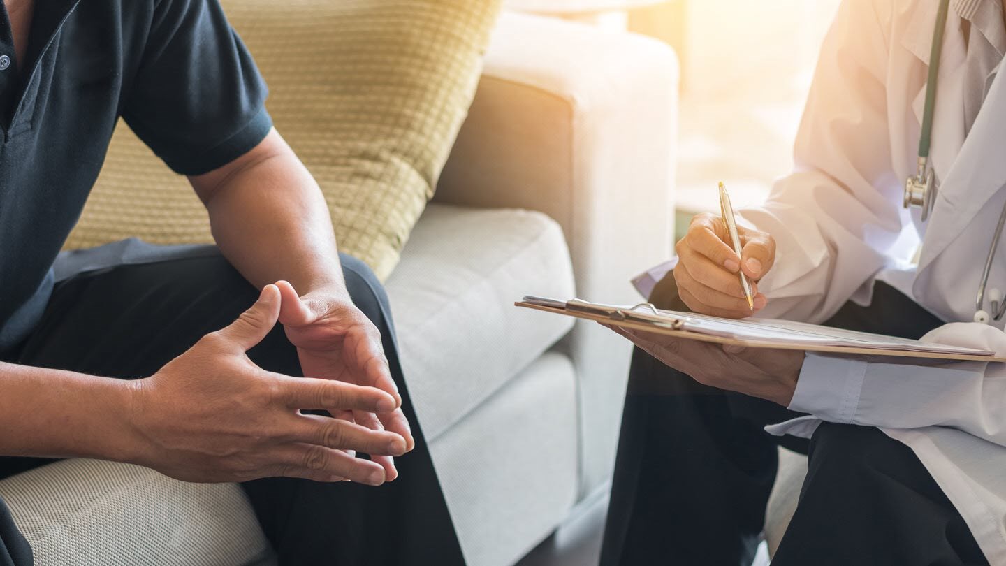 A man visits his local doctor in connection with his asthma diagnosis.