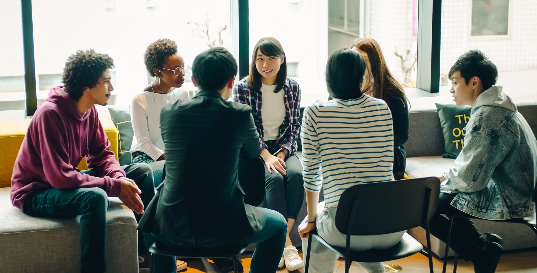 Group of young people sitting and talking