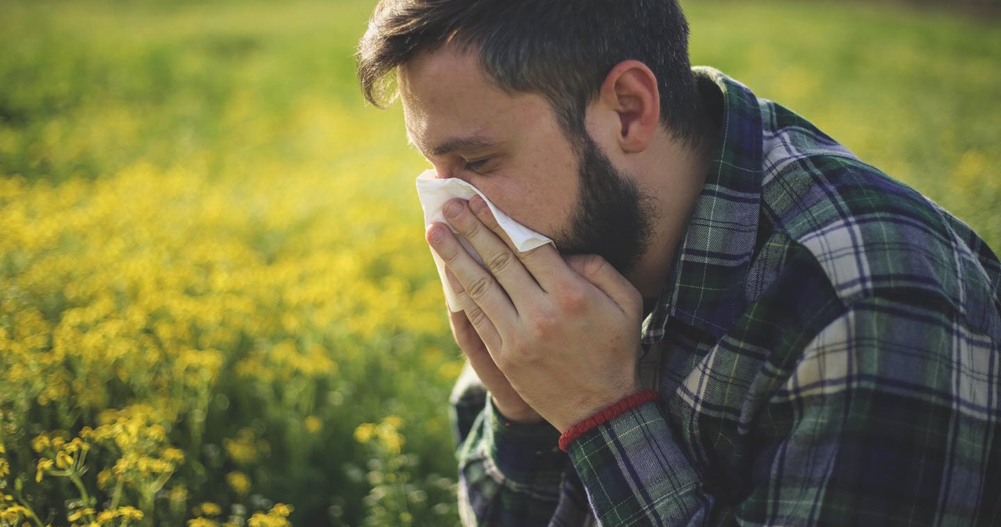 Man with asthma suffers from seasonal allergies