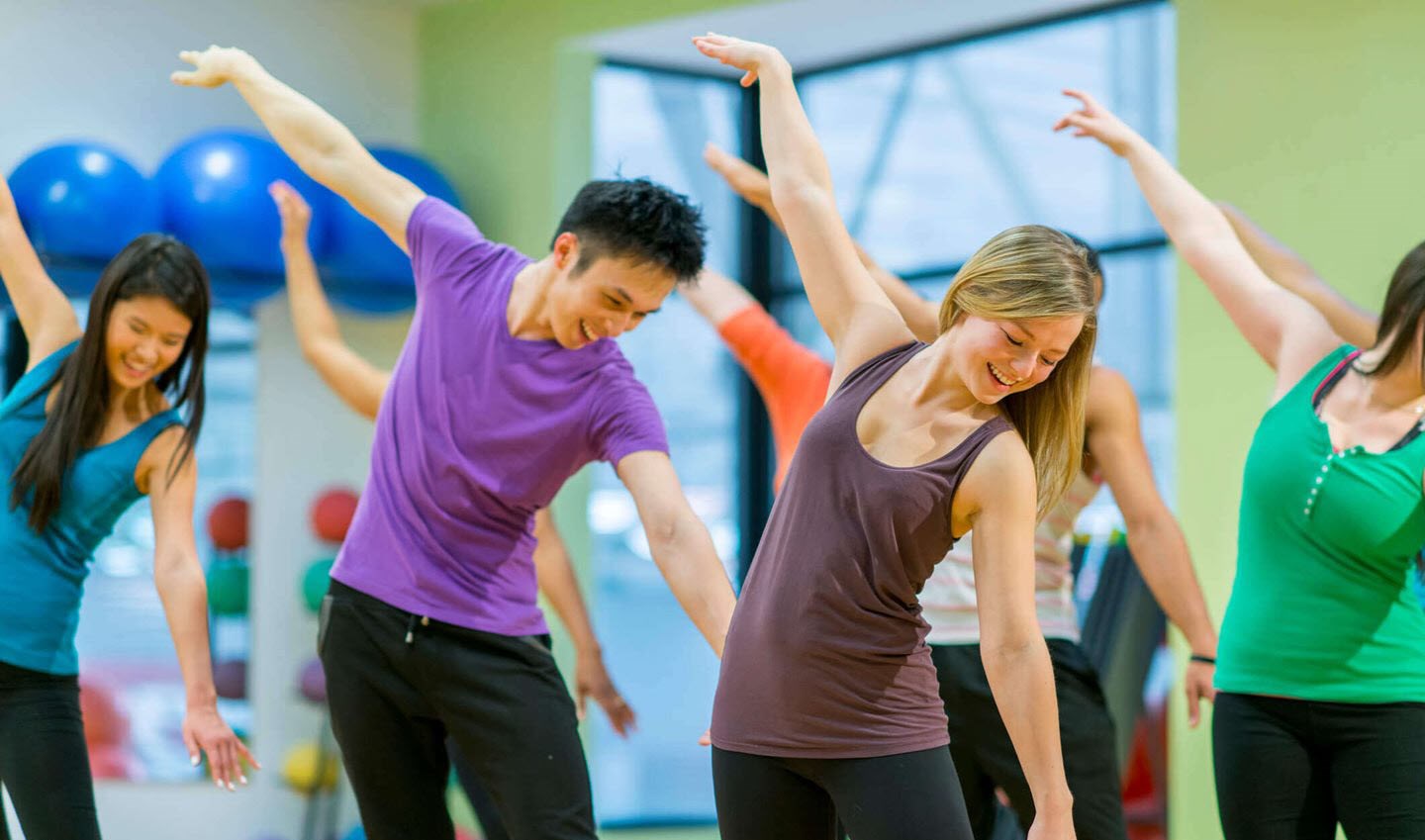 Woman enjoys a group exercise class despite living with asthma