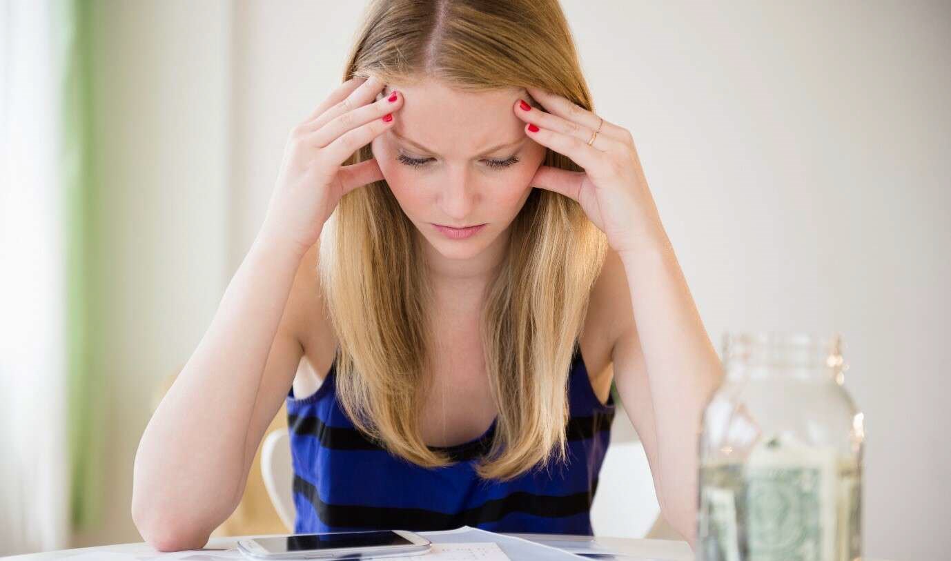 Woman looking over her finances, checking how much her asthma treatment has cost her this month