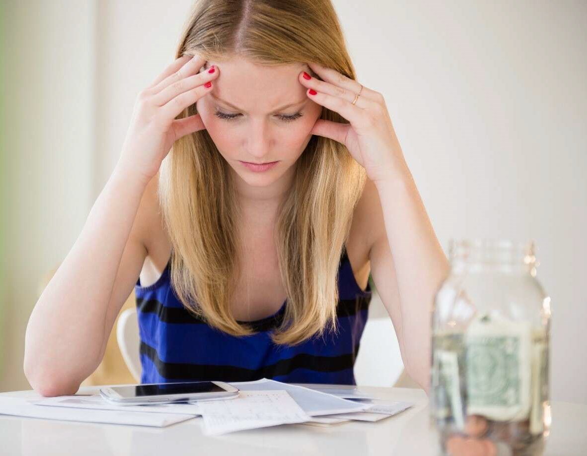 Woman looking over her finances, checking how much her asthma treatment has cost her this month