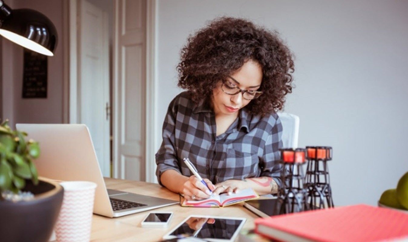 Woman with ADHD successfully managing her business from home