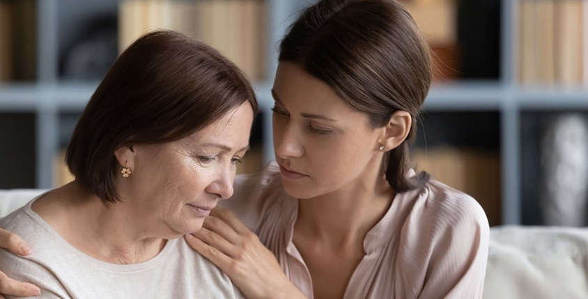 Daughter hugs her mum