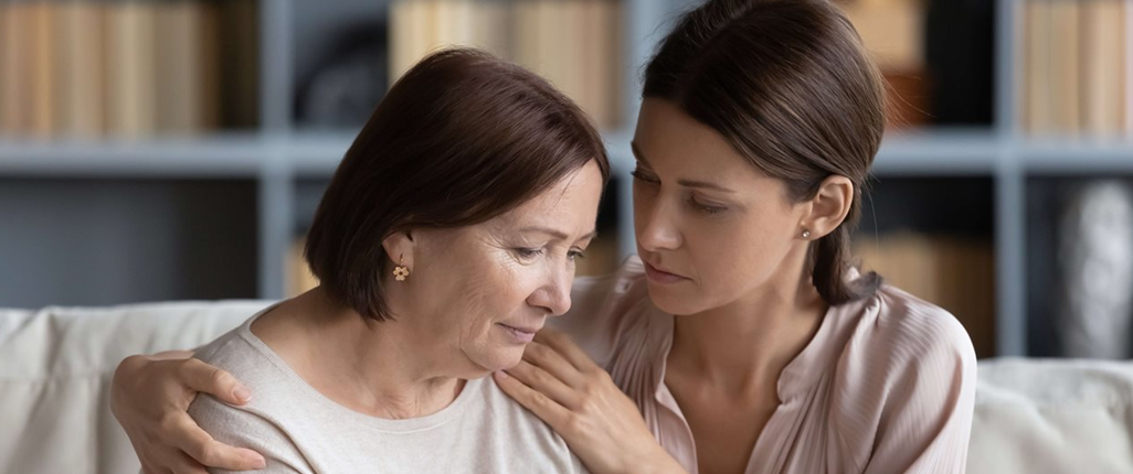 Daughter hugs her mum