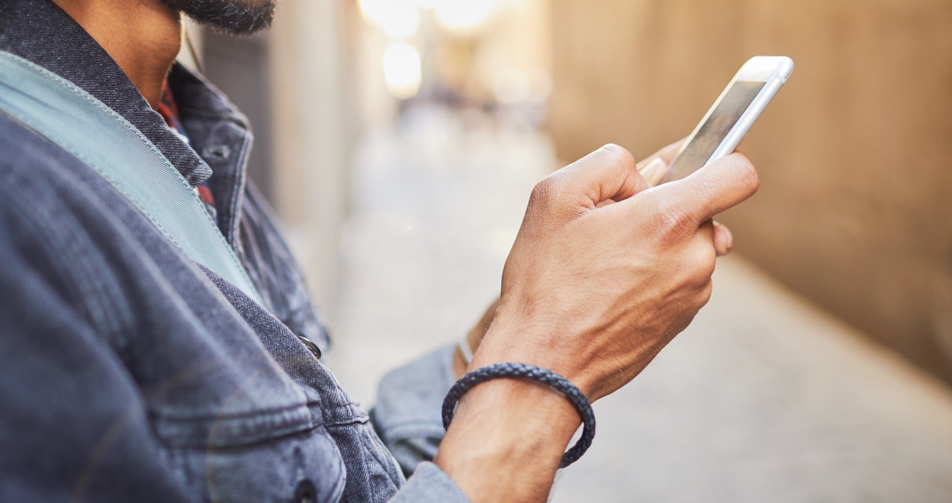 Man scrolling on his phone