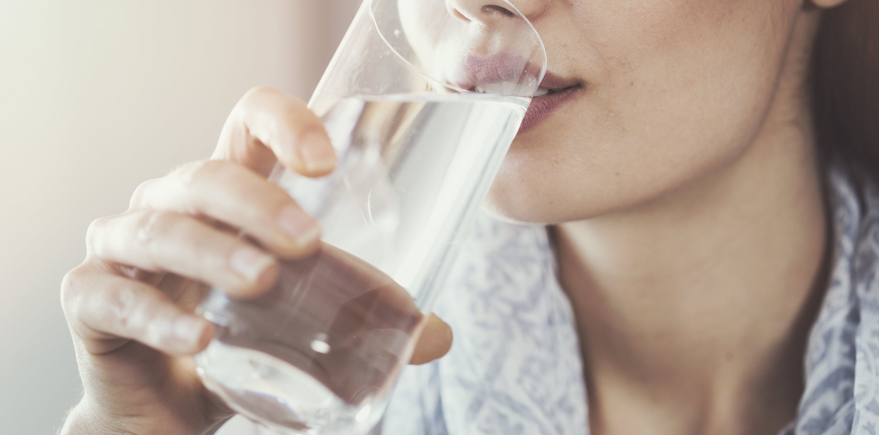 Woman ingests a migraine cocktail to help manage and reduce her pain