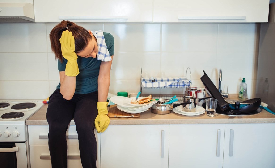 Woman struggling with depression and overload of household chores