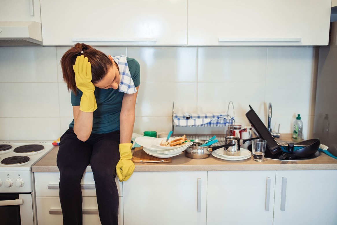 Woman struggling with depression and overload of household chores